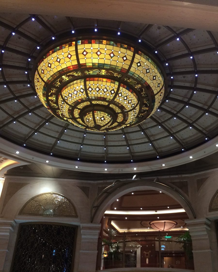 Stained-glass dome above a cruise ship atrium